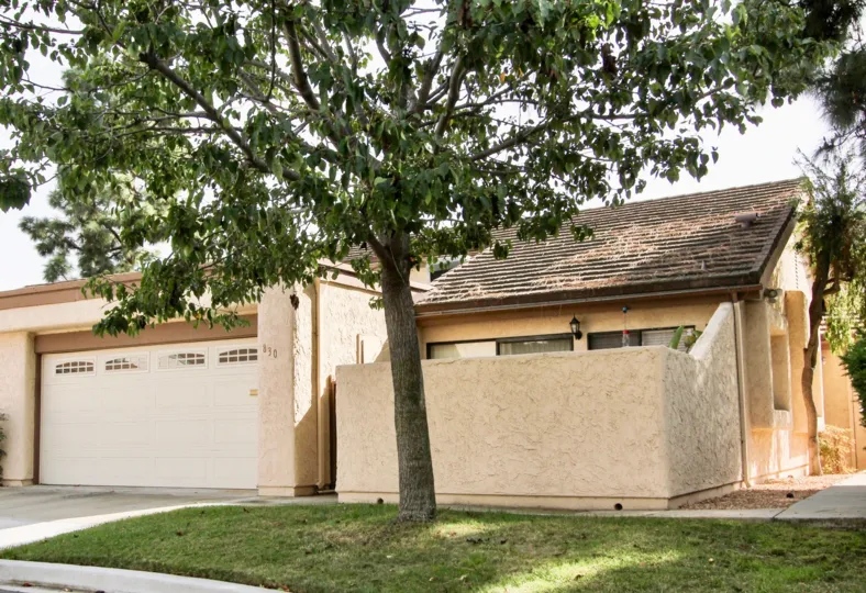 A sunny day in the area of Windsor View, outside, garage, grass, patio, trees