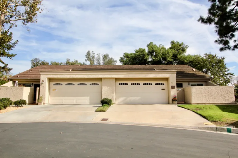 A sunny day in the area of Windsor View, outside, street, garages, trees, grass, bushes