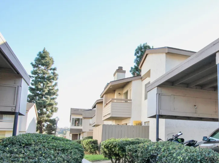 THE BUNGALOW IN THE WOODSIDE VILLAGE WITH THE CAR PARKING, BIKE, TREES, PLANTS, BALCONIS