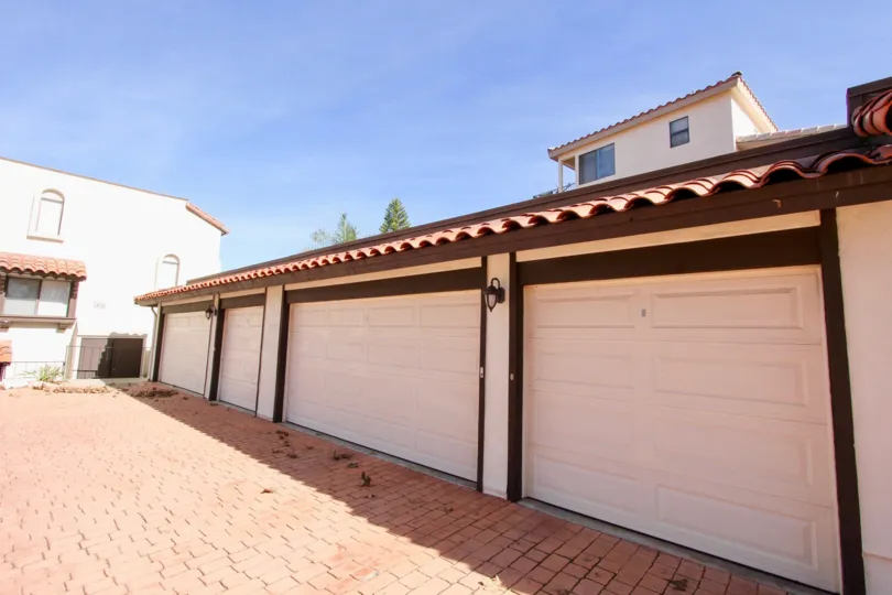 Cream colored garages with brown detailing in Bay Vista in Clairemont Mesa, California.