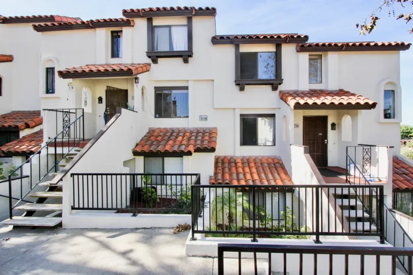 Three story residential building with black iron gates at Bay Vista in Clairemont Mesa California