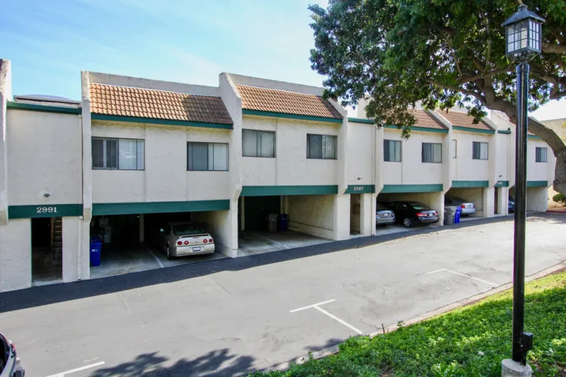 Driveway along side of parking area and residential buildings at forest park plaza in Clairemont Mesa California