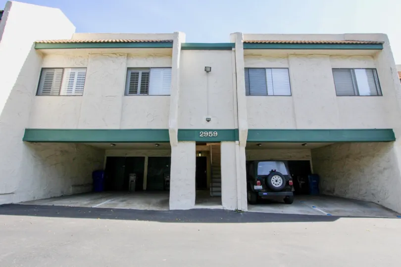 A two-storey building in Forest Park Plaza with ground-level parking.
