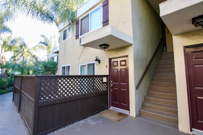A wooden brown fence surrounds the patio of a home at the Heritage Park East community in Clairemont Mesa, California.
