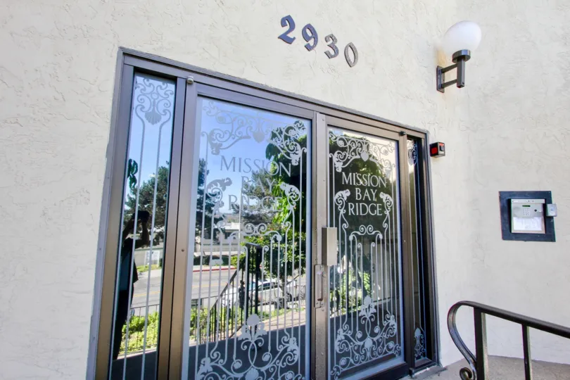 Glass doors leading to the entrance to Mission Mission Bay Ridge in Clairemont Mesa, California.