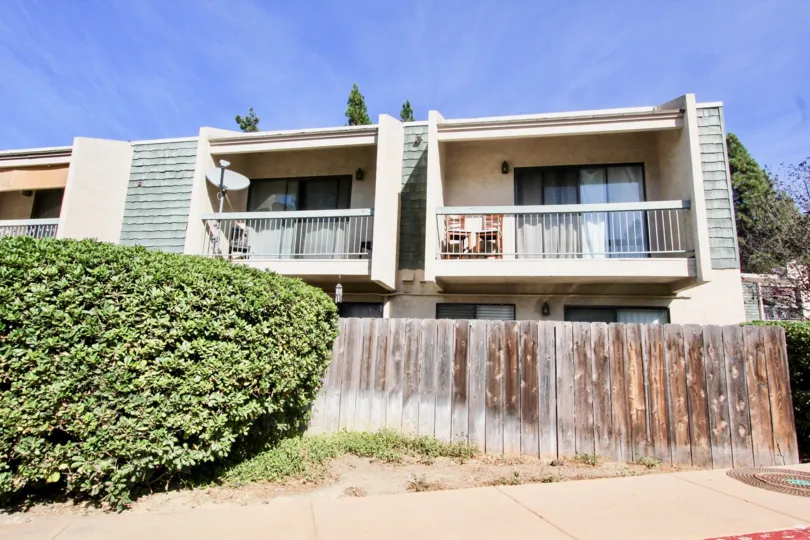 Multi-family complex with private back deck and yard with fence on bottom level in Clairemont Mesa, California