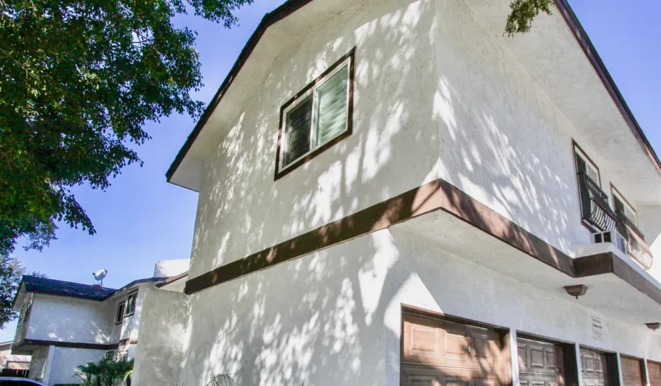 A two level apartment building with lower level garage in Blossom Park, College Area California.