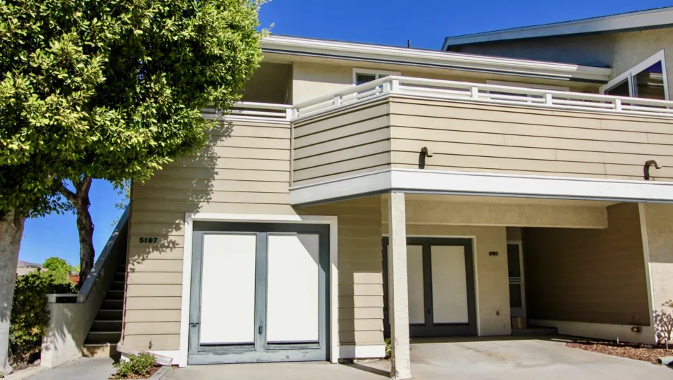 Balcony view of a tan colored unit 5197 located in Canyon Trails of College Area, California