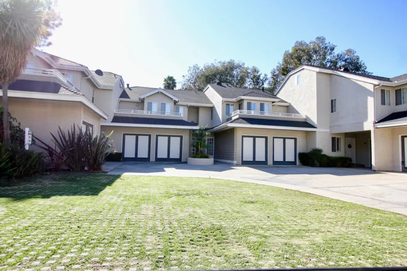 Two level, cream colored homes in Canyon Trails in College Area, California.