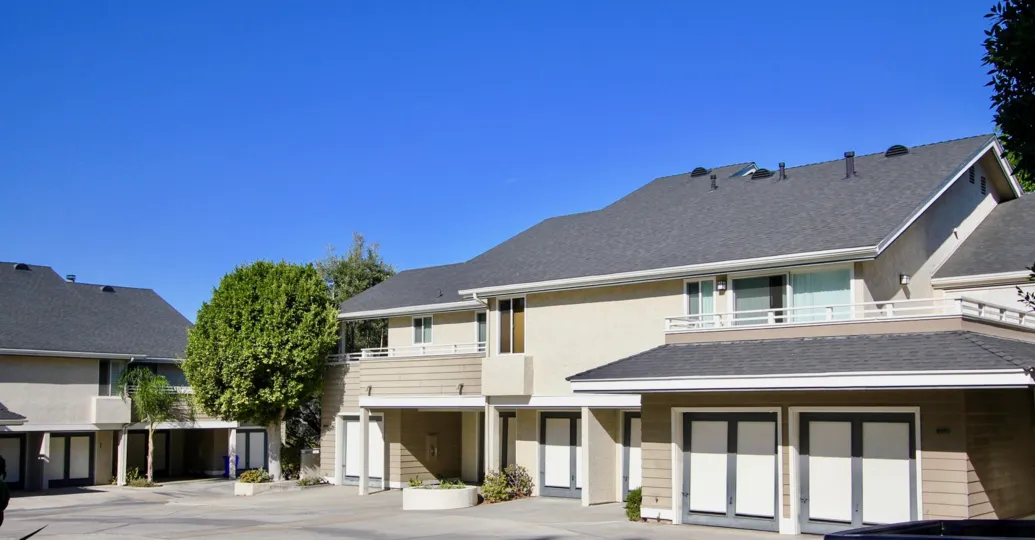 White garage doors have dark dray trim at Canyon Trails condos