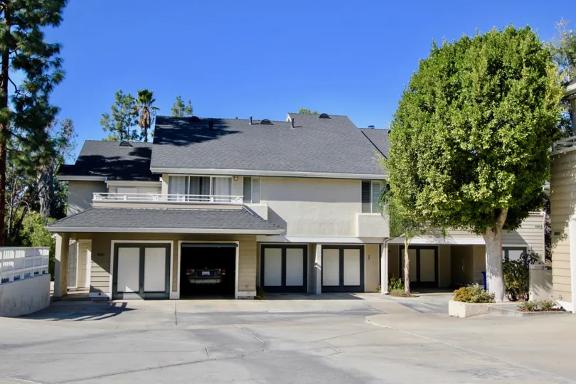Two story housing unit with parking lot at Canyon Trails in College Area California