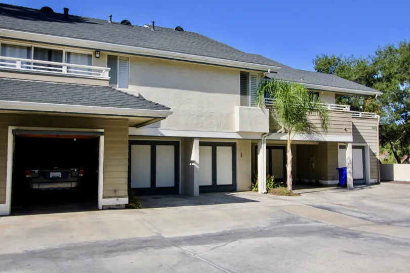 Two story housing unit with built in garages at Canyon Trails in College Area California