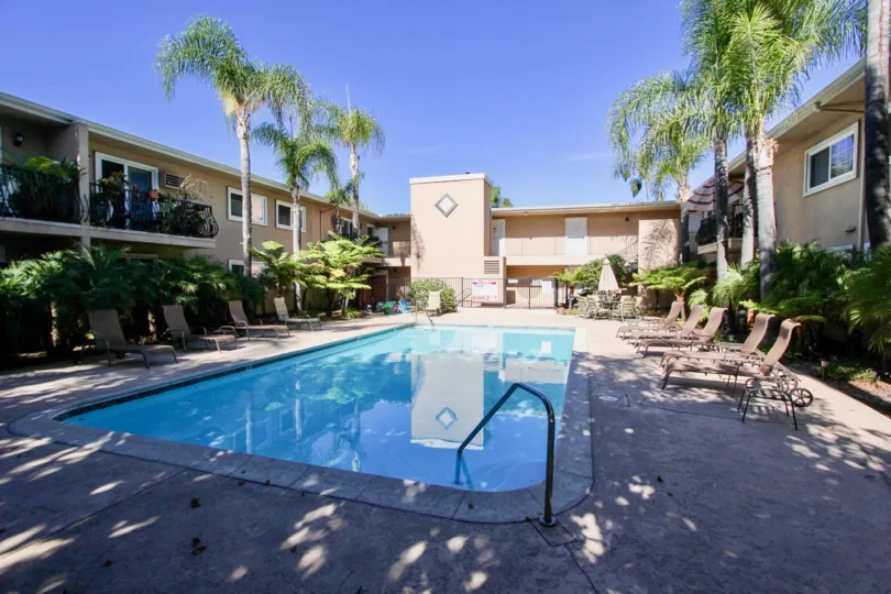 Swimming pool surrounded by residential building at Carriage House in College Area California