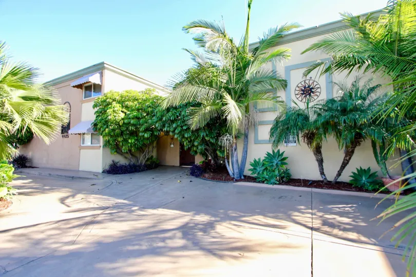 Driveway next to residential buildings at Casa Del Sol in College Area California