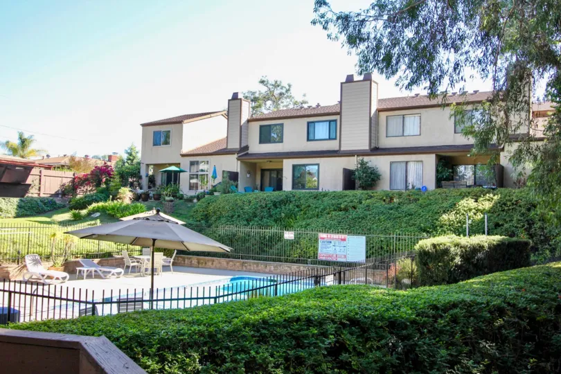 House units overlooking a swimming pool at Chateau Marquis in College Area California