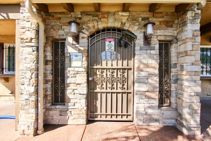 Secured gate entrance to residential building at City Courtyard in College Area California