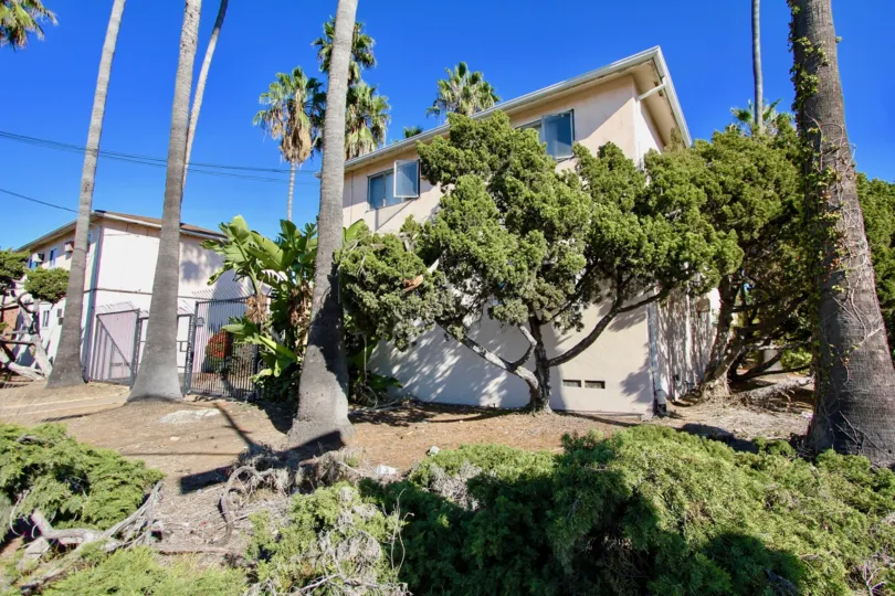 College Gardens, College Area, California, Two story home on land lot with trees and a fence
