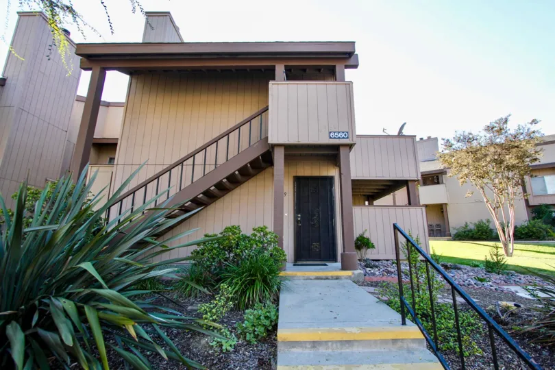 Excellent front view of a villa with lawn and staircase in College Grove Village of College Area