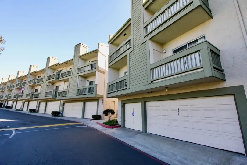 Multi level residental buildings with garages below in College Park Townhomes community.