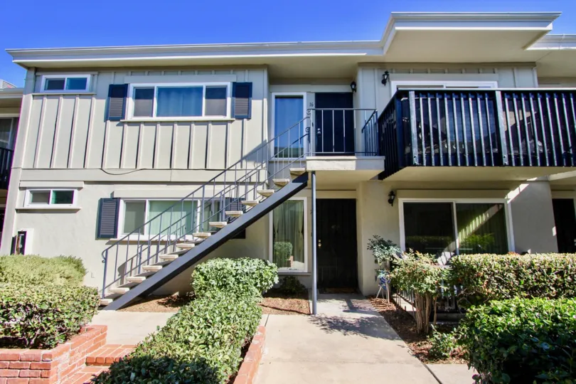 A large white Colonial House in Colonial House community at College Area CA