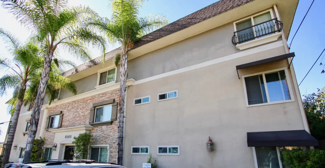 Courtyard at College community College Area California palm trees window box windows covered entry shrubs landscaping outdoor lighting