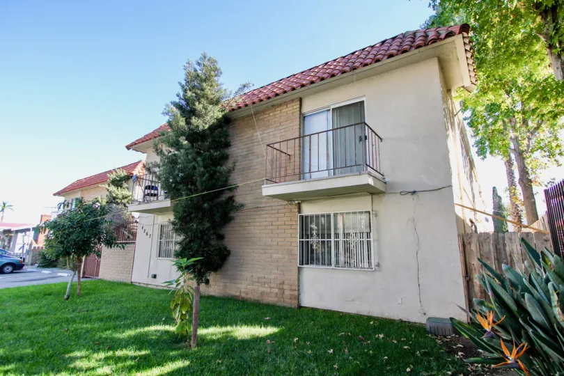 A sunny day in the Hoover Heights with residential building and trees.