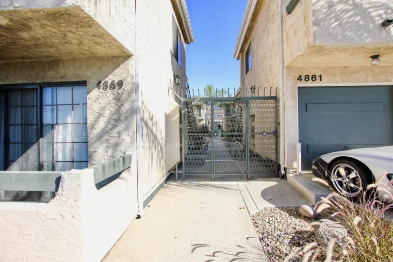 A front view of two house with the number 4869 and 4861 which is located in California State, College Area City and Isabella Park Community.