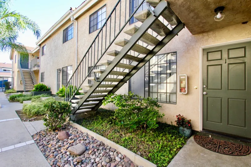 Two story residential building with attached staircase at Isabella Park in College Area California