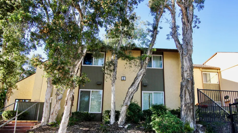 Residential building surrounded by iron gate at Lake Park Villas in College Area California
