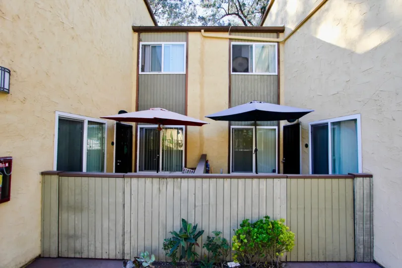 Two Umbrella is hanger in Two House with bushes in Lake Park Villas