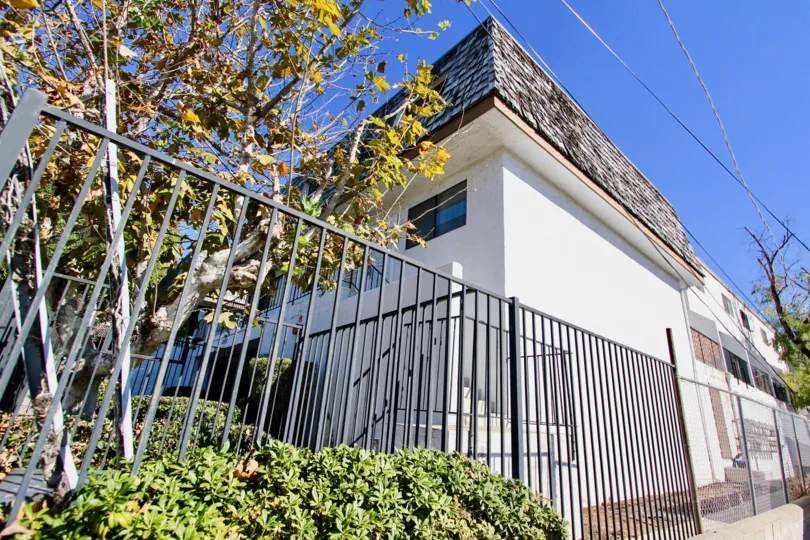 White fenced in unit located within Mediterranean Villas of College Area, California