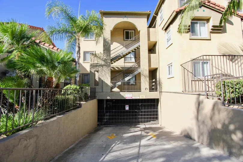 THE APARTMENT IN THE MENLO VILLAGE WITH THE UPSTAIRS, STEEL GATE, TREES, PLANTS