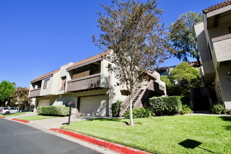 Road view on a Montezuma Townhomes community house in College Area, California