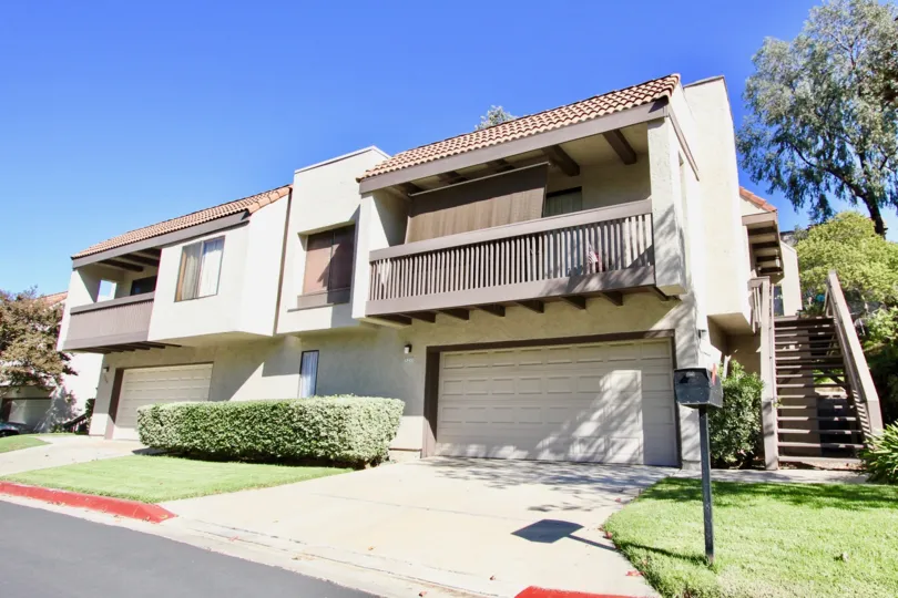 Off white 2 unit structure with large balconies located in Montezuma Townhomes in College Area, California