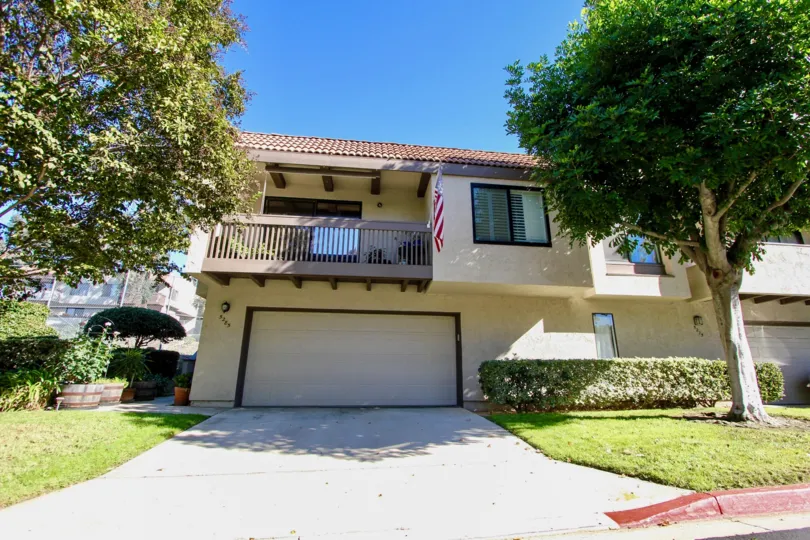 Attached home with double car garage, large front facing balcony and yard with mature trees in College Area