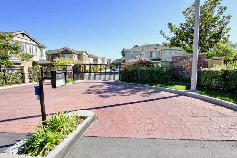 Main gate view of Orange Walk community area, College Area, CA