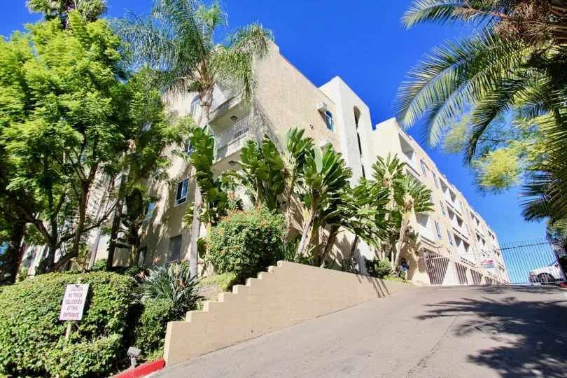 Driveway next to large multiple story buildings at Parkridge in College Area California