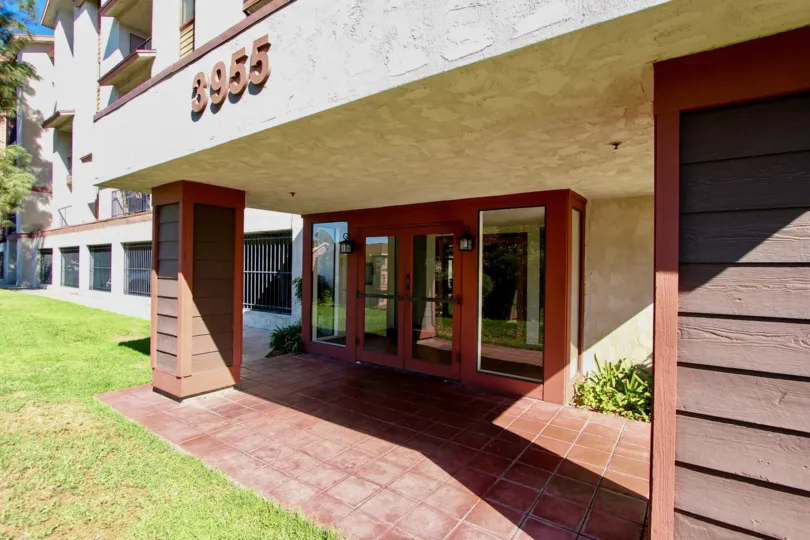 Awesome front view of a villa with lawn and number display on a sunny day in Sunrise Point of College Area