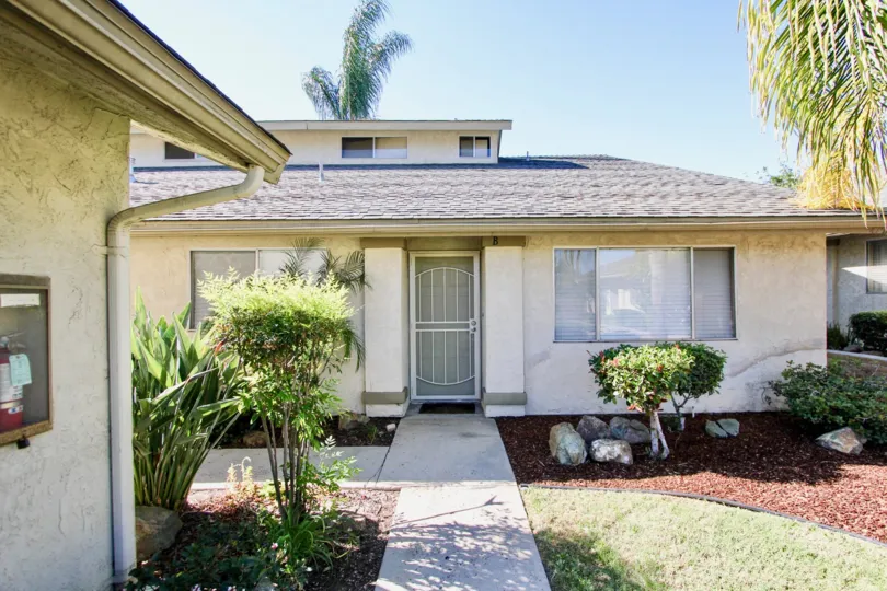 THE BUNGALOW IN THE WELLINGTON TOWNHOMES WITH THE PLANTS, TREES, FIRE SAFETY