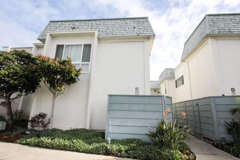 Housing with a walkway in between units at Antigua Court in Coronado California