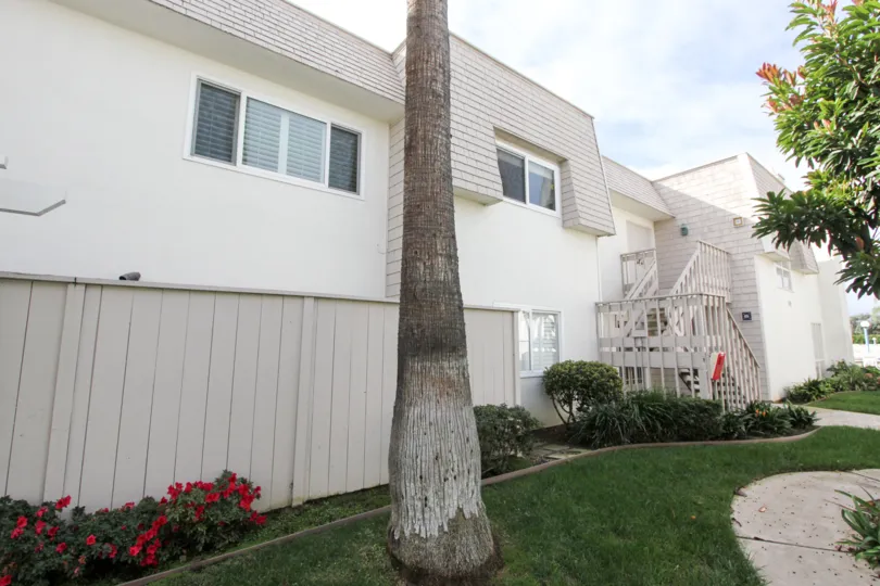 The beautiful and serene apartment complex of Antigua Court with it's bright and airy colors on a sunny day in California.