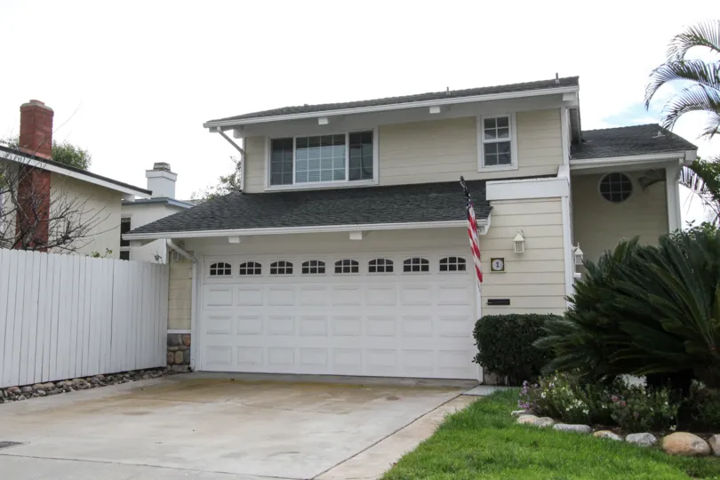 A house with a garage and American flag in Coronado