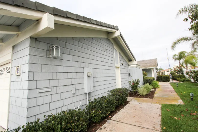 A bungalow with bluish wood cladding in the Bahama Village community.