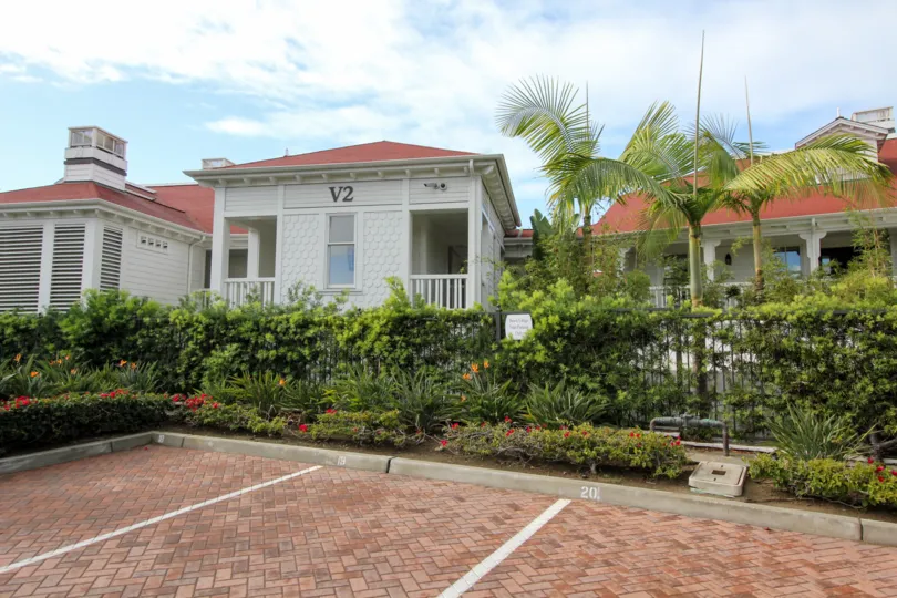 A sunny day in the area of Beach Village at the Del, parking lot gated community