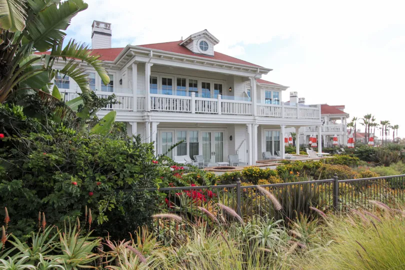 Two story housing surrounded by plants at Beach Village at the Del in Coronado California