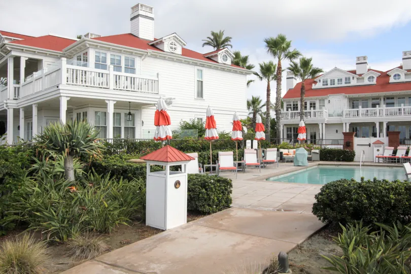 Swimming pool surrounded by residential units at Beach Village At The Del in Coronado California