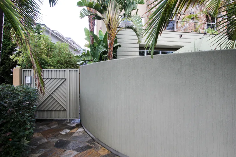 Security gate on the side of a residence at Bridgend Lanai in Coronado California