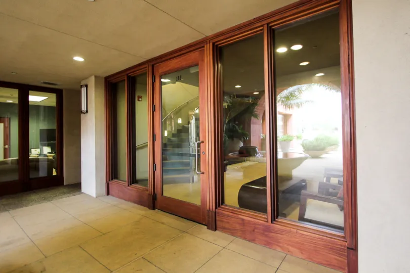 Wooden framed glass door entrance at Coronado City Views in Coronado California