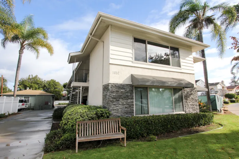 Two story home with bench and yard at Coronado Pointe in Coronado California