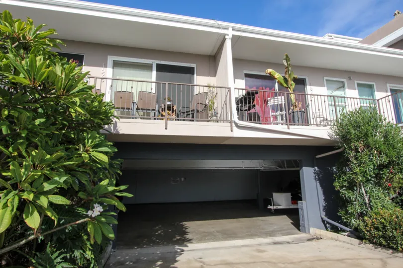 Two story residential building with parking at Glorietta Bay in Coronado california